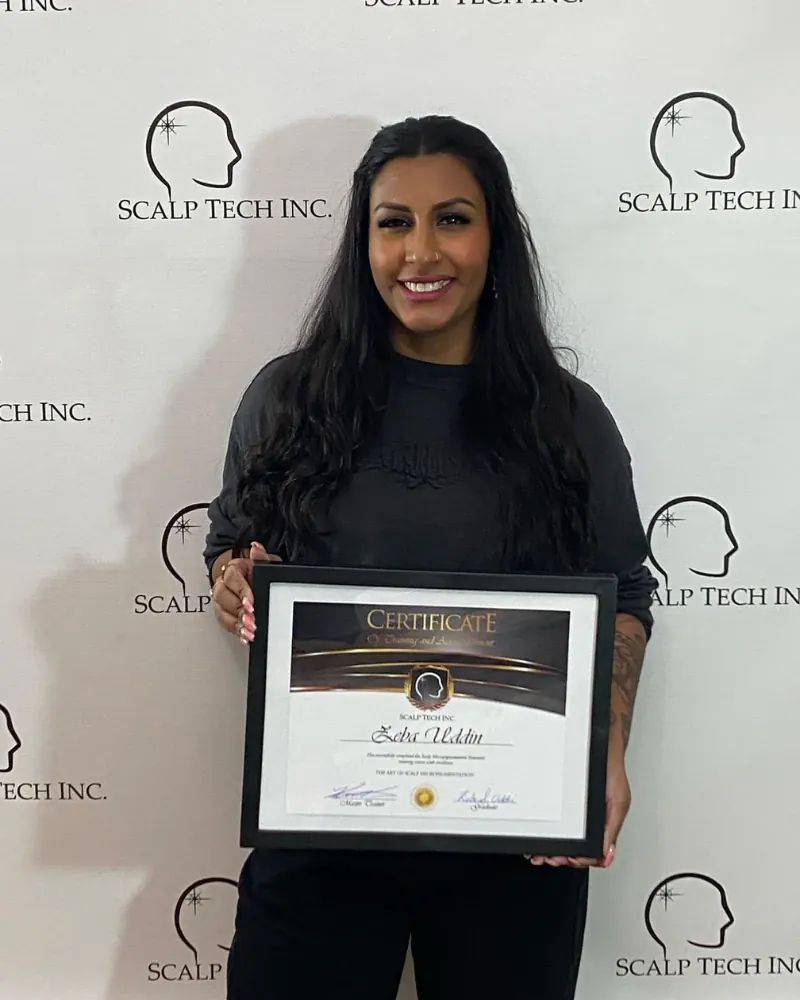 Scalp Tech Inc. training graduate with certificate